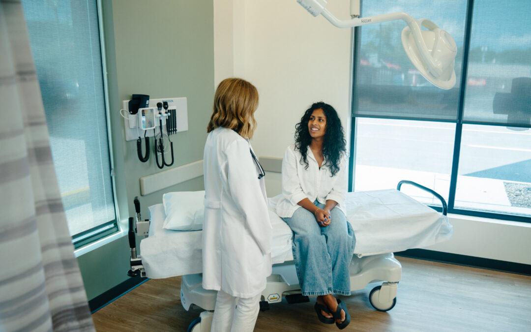 AFC provider talking with a patient about long COVID.