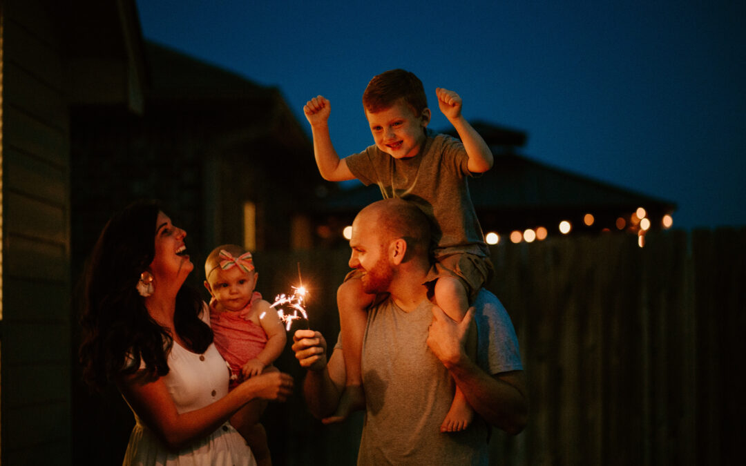 Happy Family doing sparkler fireworks together